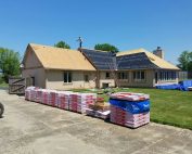 Most don’t think about the roof of their home very often, and that’s how it should be. Odds are, if you have been thinking about your roof lately it’s because you’ve experienced a bad storm or have recently noticed new and/or worsening leaks. Occasionally, all a homeowner needs to do is patch things up and replace a few shingles. So, how do you know if you can repair the damage to your roof or if you should simply replace it entirely? While you definitely want to have your roof checked by an expert before making a decision, here are 7 easy DIY assessments to help you get a better idea. Is Your Roof Ready to Retire? Depending upon the quality of materials used, some roofs may last up to 50 years. Most roofs, however, are laid with typical asphalt shingles, the majority of which are ready to retire after 20. For those who purchased their home from a previous owner, reshingling and other repairs have most likely been made on top of the original roofing. And if this sounds familiar, it’s also likely that you’re not entirely sure how old your roof actually is. Luckily, homeowners are required to keep record of all the improvements they made to their homes, and a simple review of those records should provide you with the information you need. If not, an experienced professional will be able to tell exactly you how much longer you can expect your roof to last. Is Your Roof Missing Shingles? If your roof is relatively new and you haven’t experienced any hail or recent storms, it’s perfectly practical to replace a missing shingle or two every now and then. But before you attempt such a seemingly easy DIY roofing project, you should first have your roof examined by a professional. Visible damages are often caused by a more serious underlying issue that an amateur may not be able to detect. Additionally, your roof is constantly exposed to rain, snow, and sunlight, and it doesn’t take long for these natural elements to fade and alter the original color of your roof. It’s nearly impossible to find new shingles that even remotely match the old, so unless you’re fond of the mismatched patchwork look, you’ll eventually need to replace your roof entirely. Do Your Shingles Lie Flat or Curled and Cracked? Your shingles should lie flat and tight against the roof of your home. If you can see gaps between them, if the edges are curling upwards, or if the shingle edges are flat but they seem to be bubbling in the middle, it’s a good sign that you need a new roof. These are signs that the adhesive is eroding, which can lead to serious leaks and other damages that cannot be ignored. Your shingles may not be curling yet, but if they’re cracking, it’s only a matter of time before they do. Wind damage is the primary cause of cracking shingles, but don’t think you need to live on the Great Plains for this type of damage. After a decade or two of continuous exposure to even moderate winds, shingles will eventually crack under pressure. Does Your Roof Have a Green Thumb? Who doesn’t love a little picturesque moss growing up the shady side of a home? But if that moss is growing on the roof, resist all urges to be charmed. Like mold inside an unwashed coffee mug, moss on your roof occurs when moisture is collected with no way to escape. While you might be able to temporarily clear away the moss with some bleach and a stiff brush, this won’t solve the larger, underlying issue at hand. Moisture has been trapped beneath the surface of your shingles for quite some time, and it will only take a few humid days and a good rain to create the perfect environment for that moss to reappear. Has Your Roof Become a Litterbug? (Ask Your Gutters) When you’re beginning to suspect that it’s time to replace your roof, your gutters can probably tell you everything you need to know. Asphalt granules play an important role in protecting your roof from the damages of continuous sunlight, but once a roof is nearing retirement, those granules crumble and flake away. A brand new roof will shed quite a bit of its granules, most of which are extra and already loose, within its first year or so. But if your gutters are littered with granules, and you know your roof is more than 10 years old, it’s a good sign that you should start planning to replace it. What’s Up? (In Your Attic) Perhaps your roof looks just fine from the outside, but what’s going on underneath? More specifically, what’s up in your attic? If your attic has been under attack by bats, birds, possums, raccoons, and other signs of wildlife, then you don’t need us to tell you that your roof is far past its retirement day. There are, of course, other ways your attic can tell you whether or not it’s time to replace your roof, and all you’ll need is a simple flashlight. Examine the ceiling and walls for water stains, streaks, and wood rot as these are signs of leakages that have yet to reach the rest of your home below. You should also check for cracks in the ceiling, which is easiest to do during the daytime because you’ll likely see streams of light of shining through. The Obvious If you recently experienced a severe winter, tornado, hail, or other harsh type of weather in your area, call a professional as soon as possible to have your roof examined for damages. Every day that passes without addressing nature’s consequences may put your home at further risk, ultimately increasing the final cost of repair.